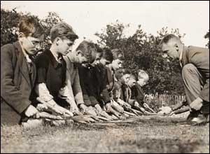 Unknown Photographer, A lesson in cutting grass with the shears, 1933, The Daily Herald Archive, NMPFT/Fox Photos Ltd
